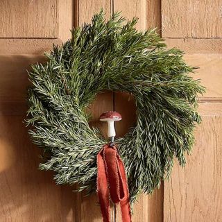 Fresh Rosemary Wreath on a wooden door.