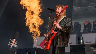 Lzzy Hale surrounded by fire