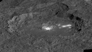 A view of the bright spots of the dwaf planet Ceres' Occator Crater. Cerealia Facula lies in the middle, while Vinalia Faculae is off to the right.