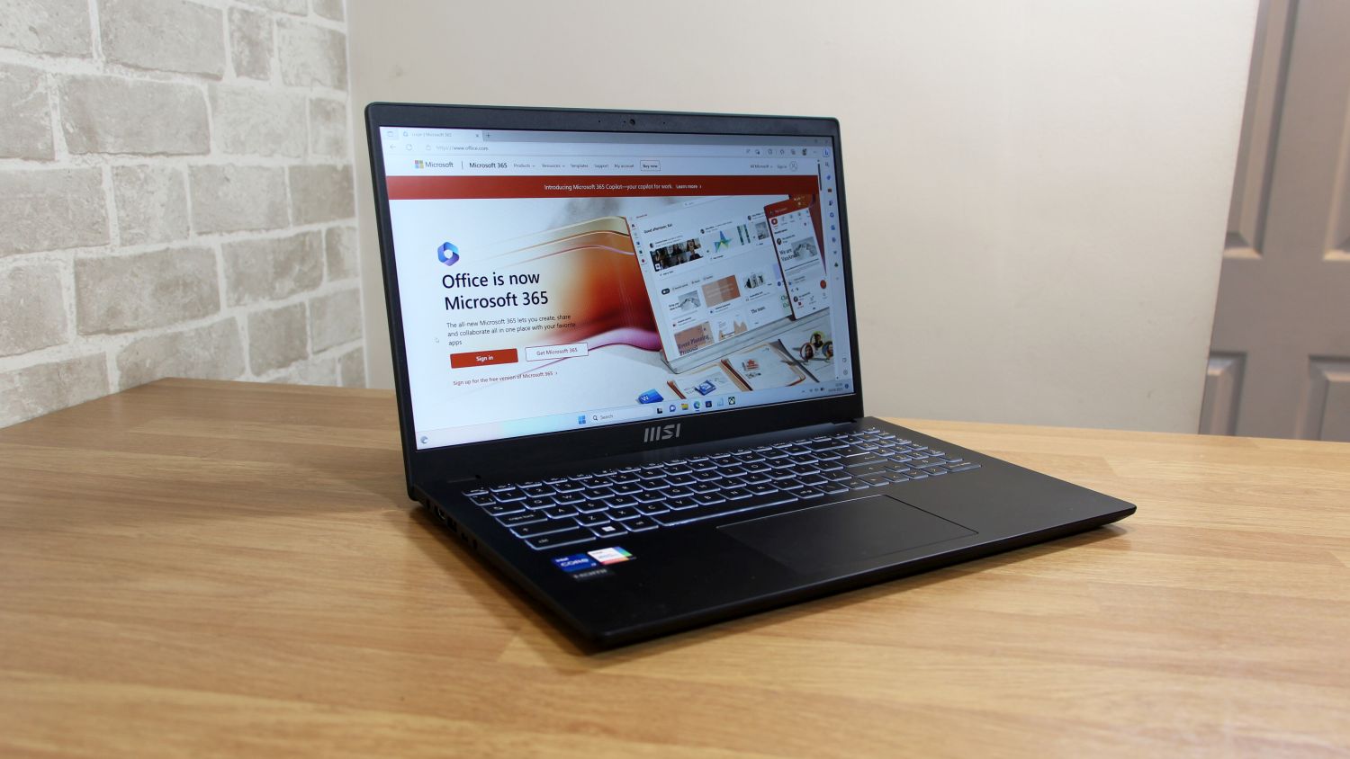 Product photo of an open MSI Modern 15 laptop, angled front view.