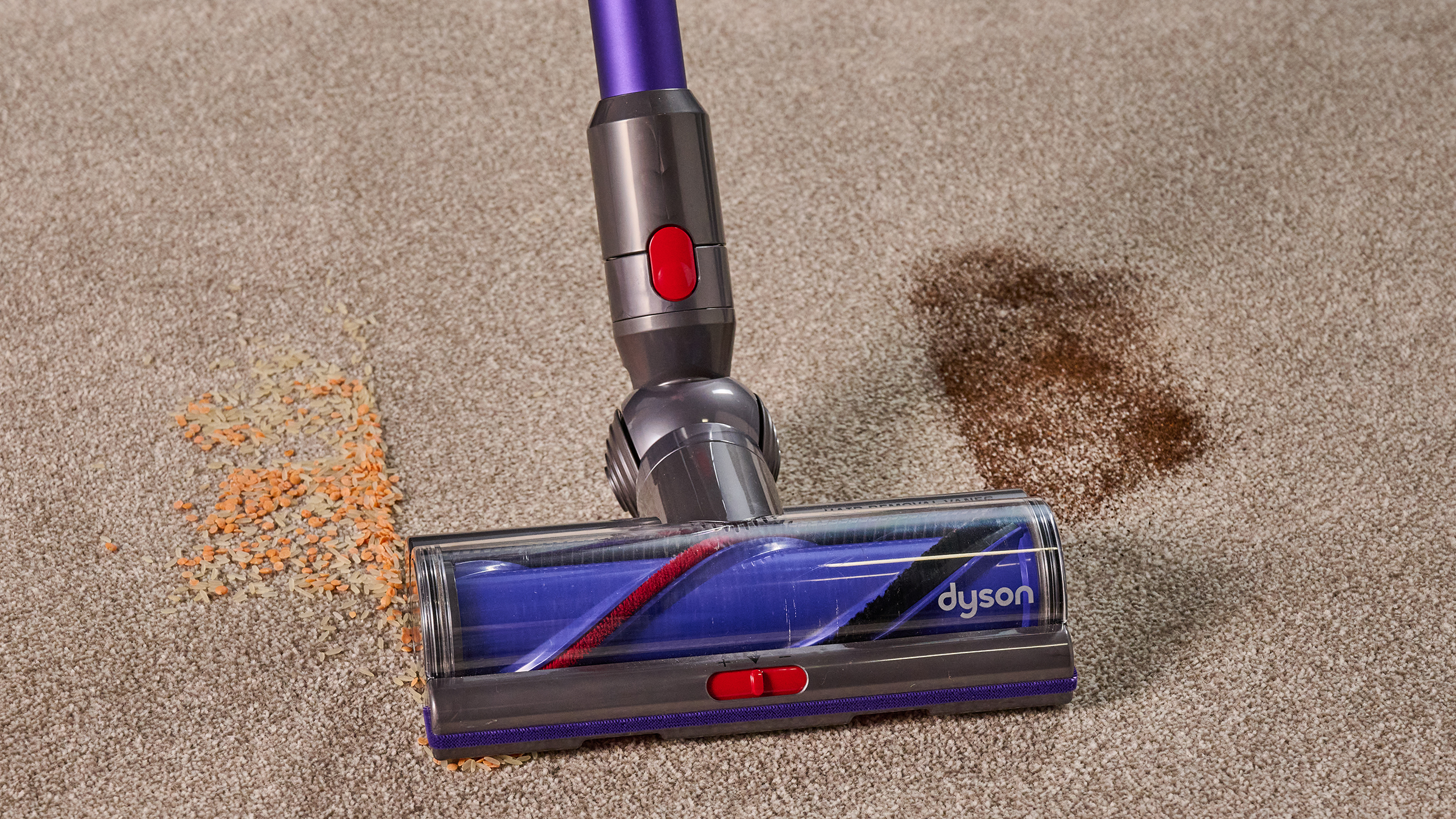 Dyson Gen5detect clearing lentils and dry tea from a carpet