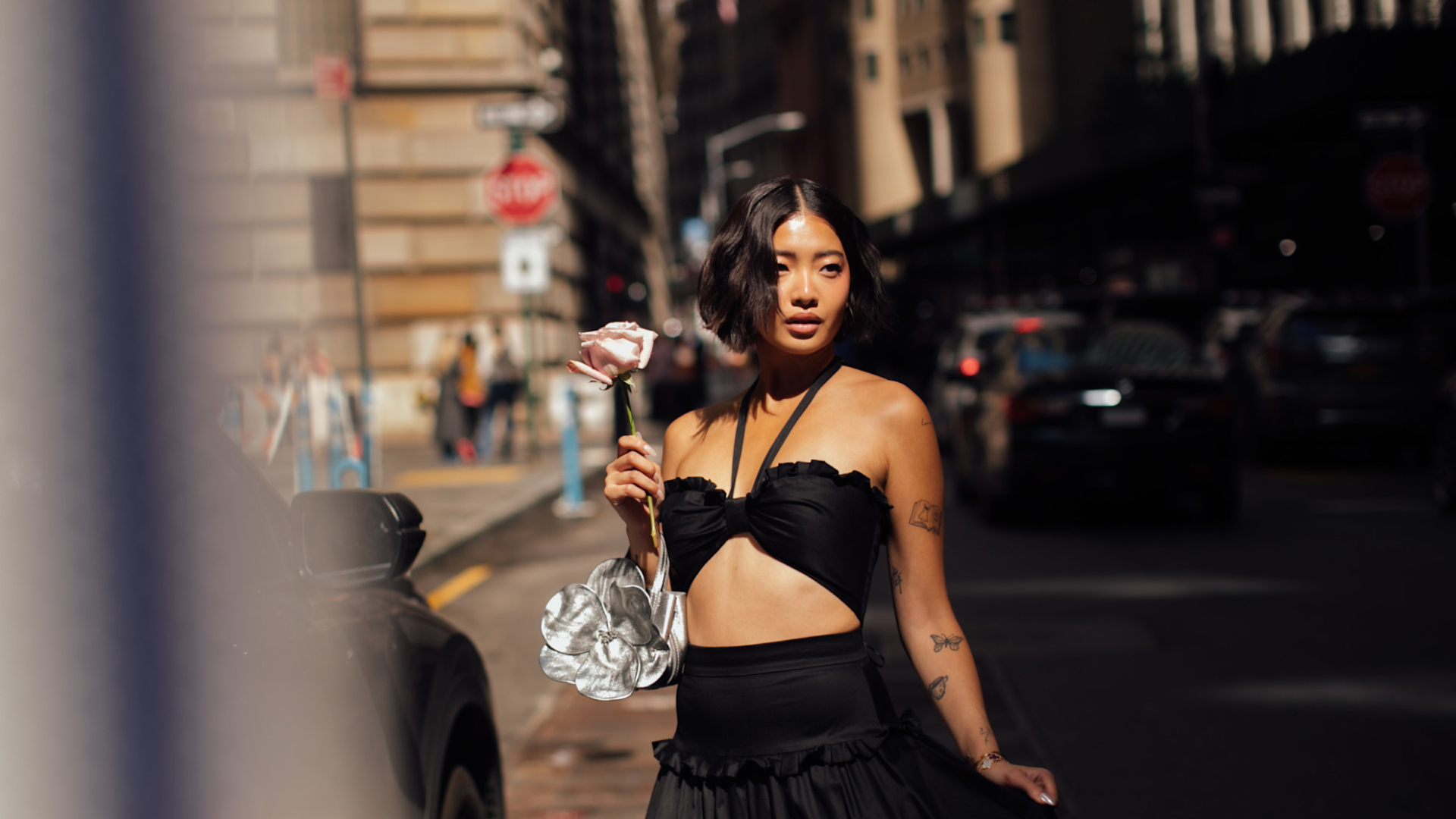 woman in a black two piece dress