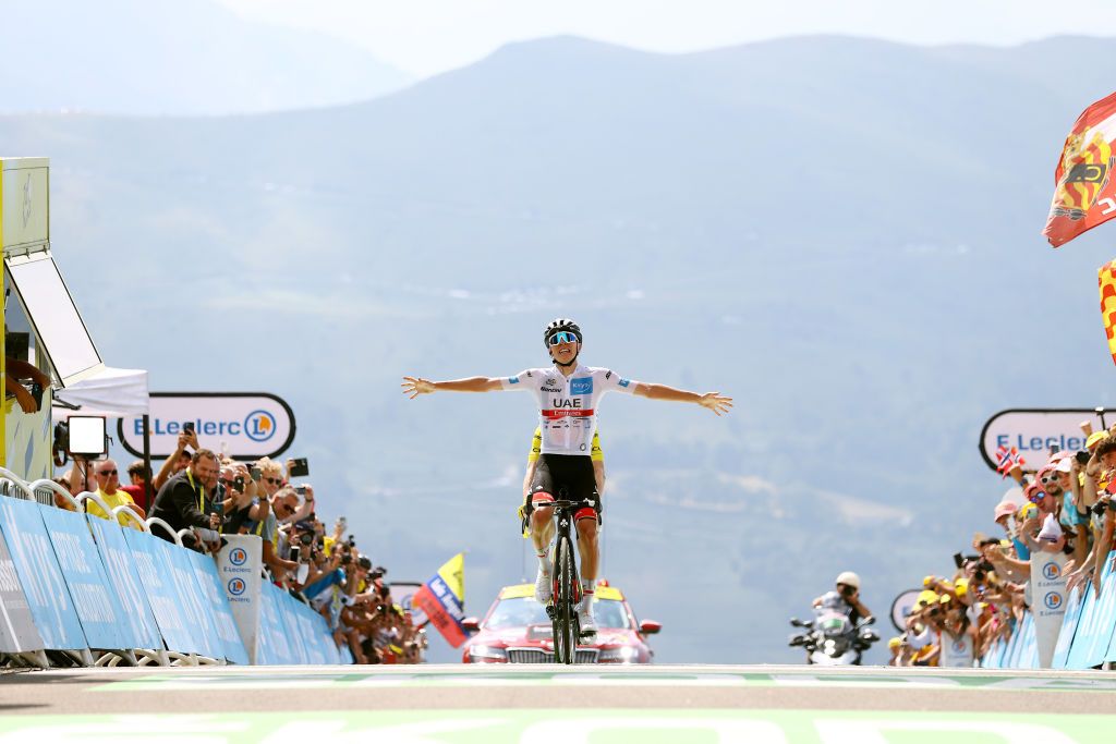 PEYRAGUDES FRANCE JULY 20 Tadej Pogacar of Slovenia and UAE Team Emirates White Best Young Rider Jersey celebrates at finish line as stage winner ahead of Jonas Vingegaard Rasmussen of Denmark and Team Jumbo Visma Yellow Leader Jersey during the 109th Tour de France 2022 Stage 17 a 1297km stage from SaintGaudens to Peyragudes 1580m TDF2022 WorldTour on July 20 2022 in Peyragudes France Photo by Michael SteeleGetty Images