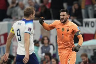 England captain Harry Kane laments his penalty miss as France goalkeeper Hugo Lloris celebrates at the 2022 World Cup.