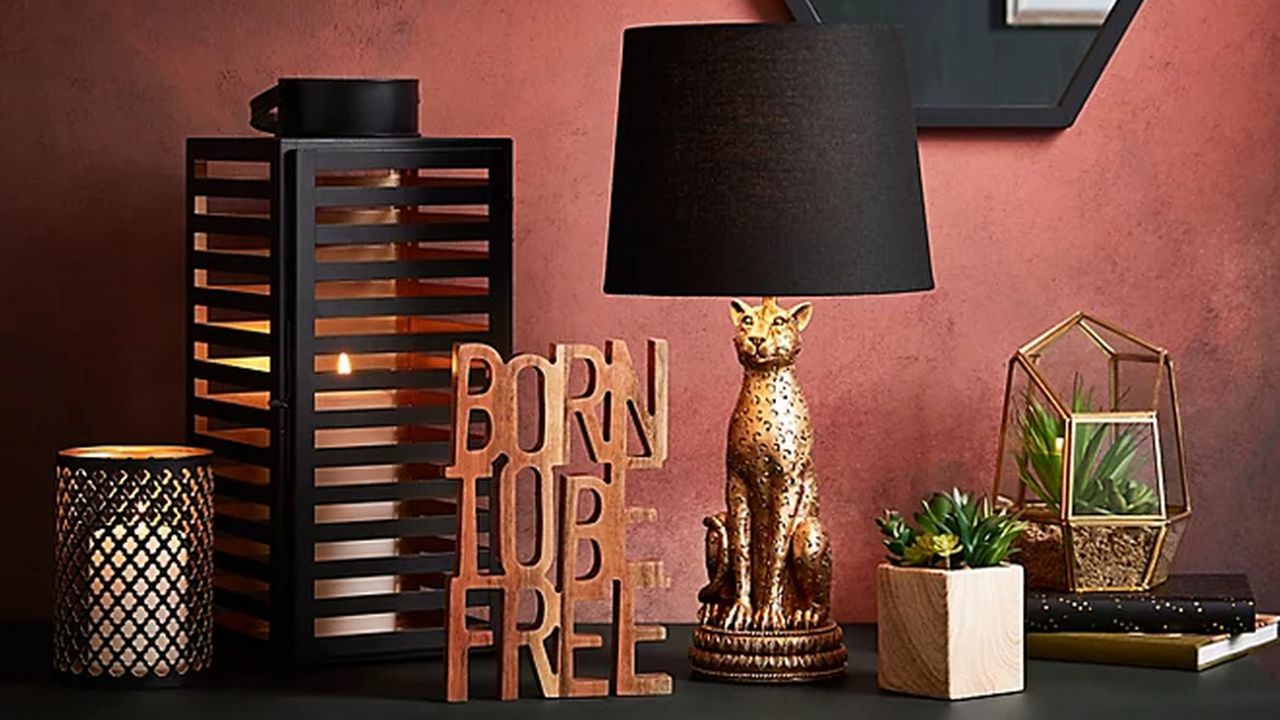 Bronze Leopard Shaped Table Lamp from George Home surrounded by decorative items