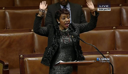 Black lawmakers strike 'Hands up, don't shoot' pose on House floor