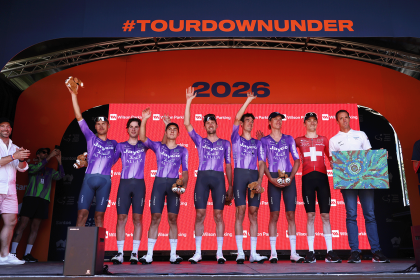 STIRLING, AUSTRALIA - JANUARY 25: Ben O'Connor of Australia, Luke Durbridge of Australia, Rudy Porter of Australia, Hamish McKenzie of Australia, Kelland O'Brien of Australia, Luke Plapp of Australia, Mauro Schmid of Switzerland and Team Jayco AlUla celebrate at podium as best team prize winners during the 26th Santos Tour Down Under 2026, Stage 5 a 169.8km stage from Stirling to Stirling / #UCIWT / on January 25, 2026 in Stirling, Australia. (Photo by Con Chronis/Getty Images)
