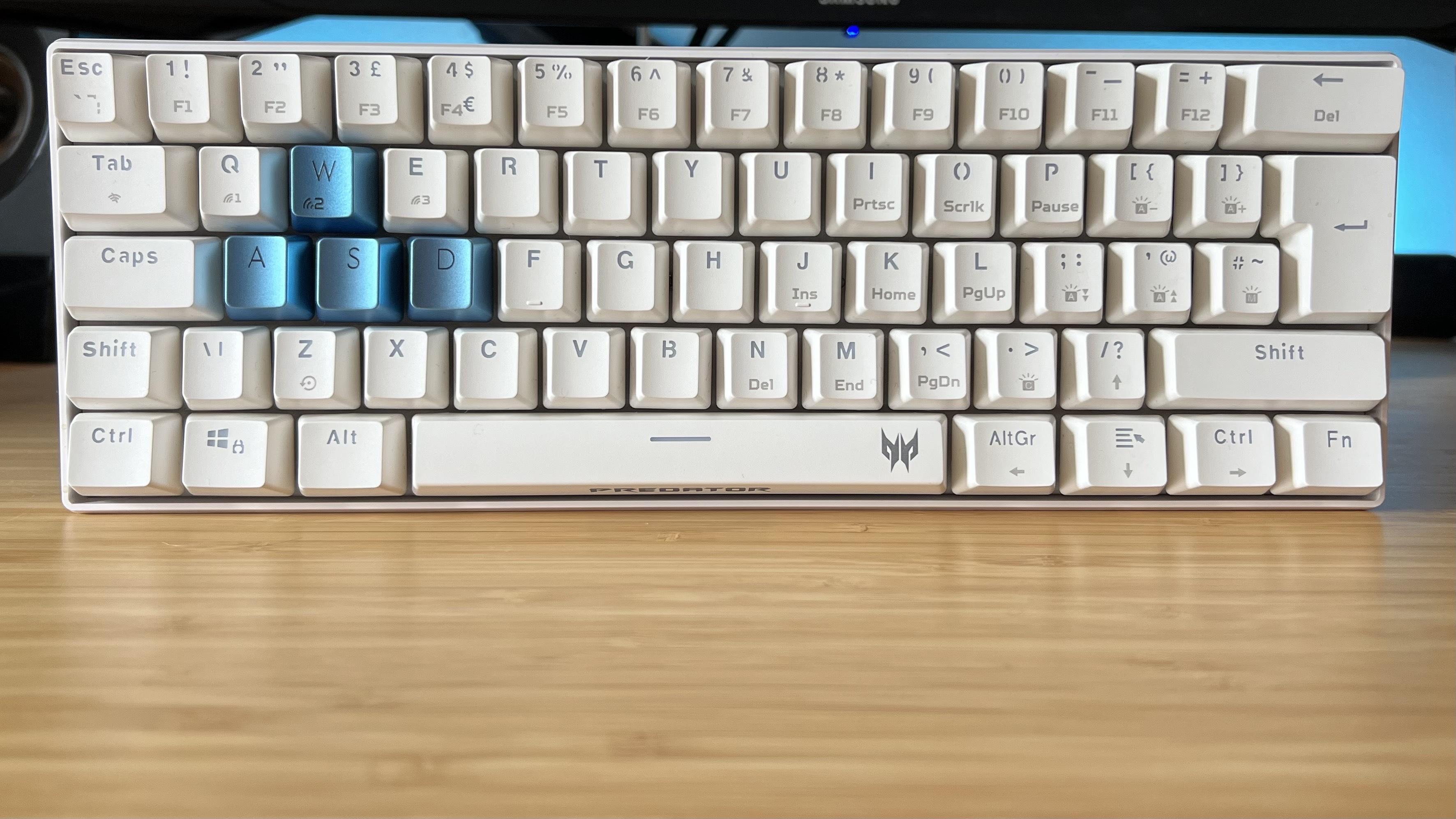 Acer Predator Aethon 330 gaming keyboard on a wooden desk