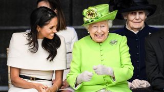 Queen Elizabeth II sits and laughs with Meghan, Duchess of Sussex during a ceremony to open the new Mersey Gateway Bridge on June 14, 2018 in the town of Widnes in Halton, Cheshire, England. Meghan Markle married Prince Harry last month to become The Duchess of Sussex and this is her first engagement with the Queen. During the visit the pair will open a road bridge in Widnes and visit The Storyhouse and Town Hall in Chester.