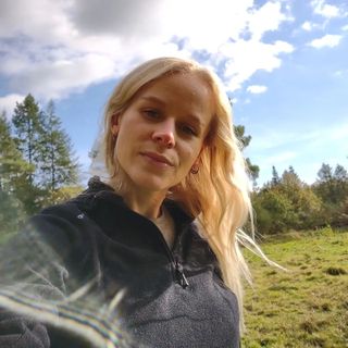 Florence Deladriere talking a selfie in a forrest