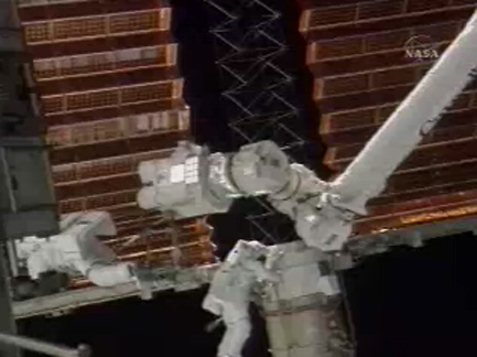 Astronauts Partially Furl ISS Solar Array in Spacewalk