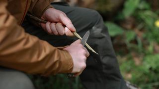 how to clean a pocketknife: knife being used to sharpen wood
