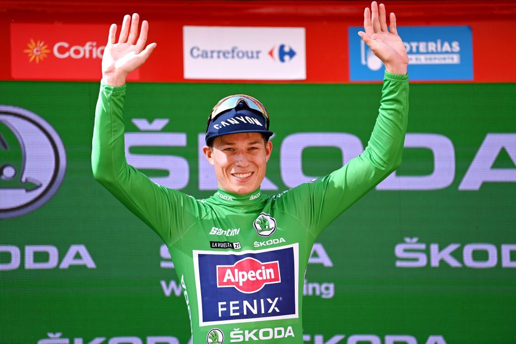 BURGOS SPAIN AUGUST 15 Jasper Philipsen of Belgium and Team AlpecinFenix celebrates winning the Green Points Jersey on the podium ceremony after the 76th Tour of Spain 2021 Stage 2 a 1667km stage from Caleruega Monasterio de Santo Domingo de Guzmn to Burgos Gamonal lavuelta LaVuelta21 CapitalMundialdelCiclismo on August 15 2021 in Burgos Spain Photo by Stuart FranklinGetty Images