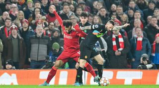 Liverpool's Mohamed Salah and Inter Milan's Marcelo Brozovic challenge for the ball during the UEFA Champions League match between Liverpool and Inter Milan on 8 March, 2022 at Anfield, Liverpool, United Kingdom