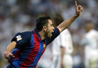 Xavi celebrates after scoring for Barcelona against Real Madrid in 2004.