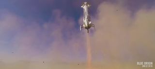 Another view of Blue Origin's New Shepard booster as it makes a smooth landing at a West Texas pad during a launch and landing test flight on Jan. 22, 2016. This image is a still from a Blue Origin video.