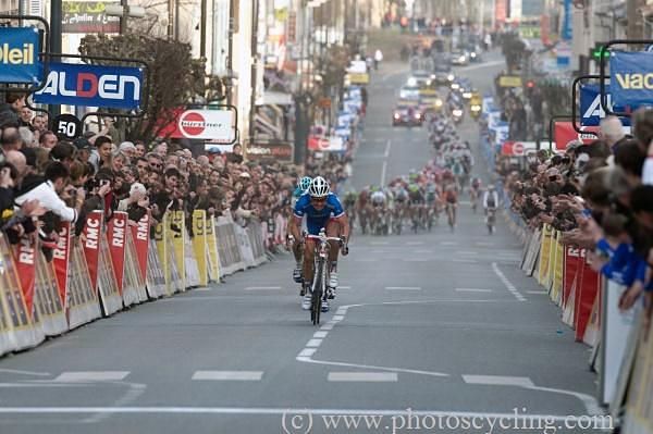 Thomas Voeckler chugs away to the finish in Belleville with the peloton well behind.
