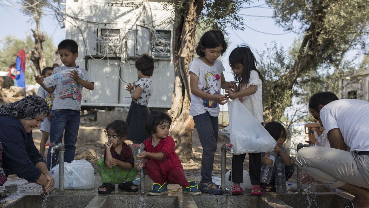 Katie Holmes and Suri Cruise Volunteer at a Syrian Refugee Camp in