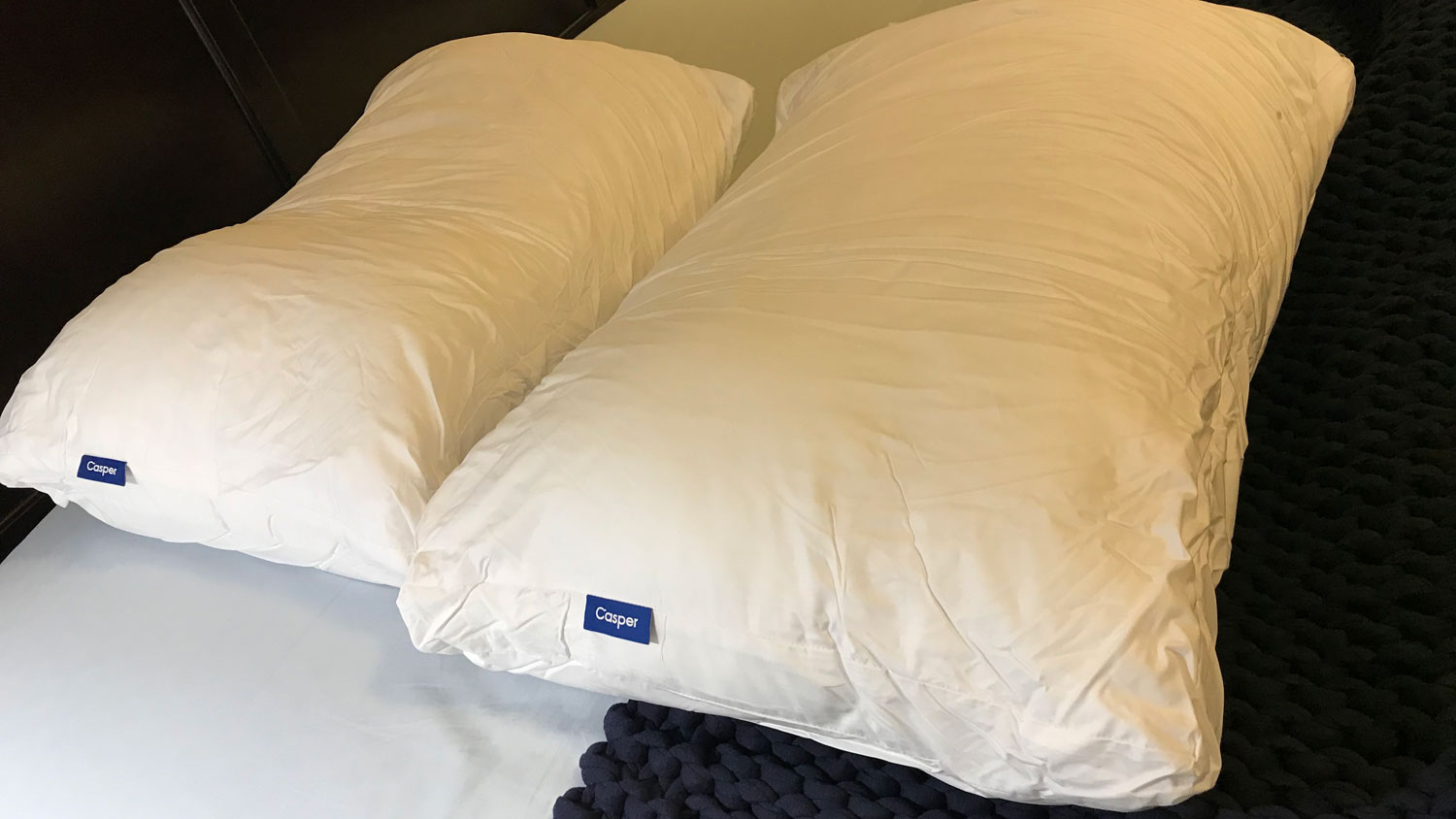 Ttwo Casper Down Pillows on a bed