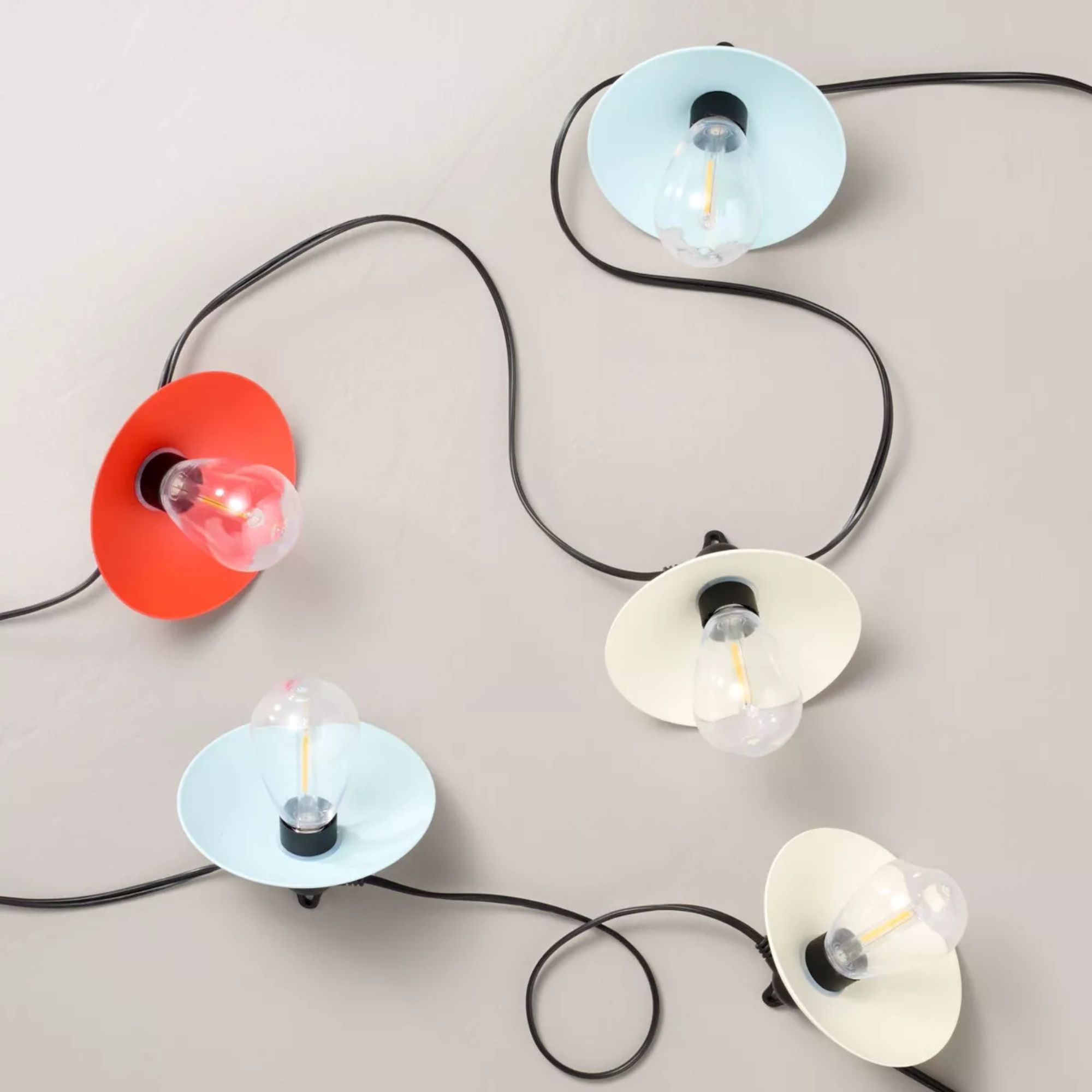 Metal string lights in pale blue, cream and red