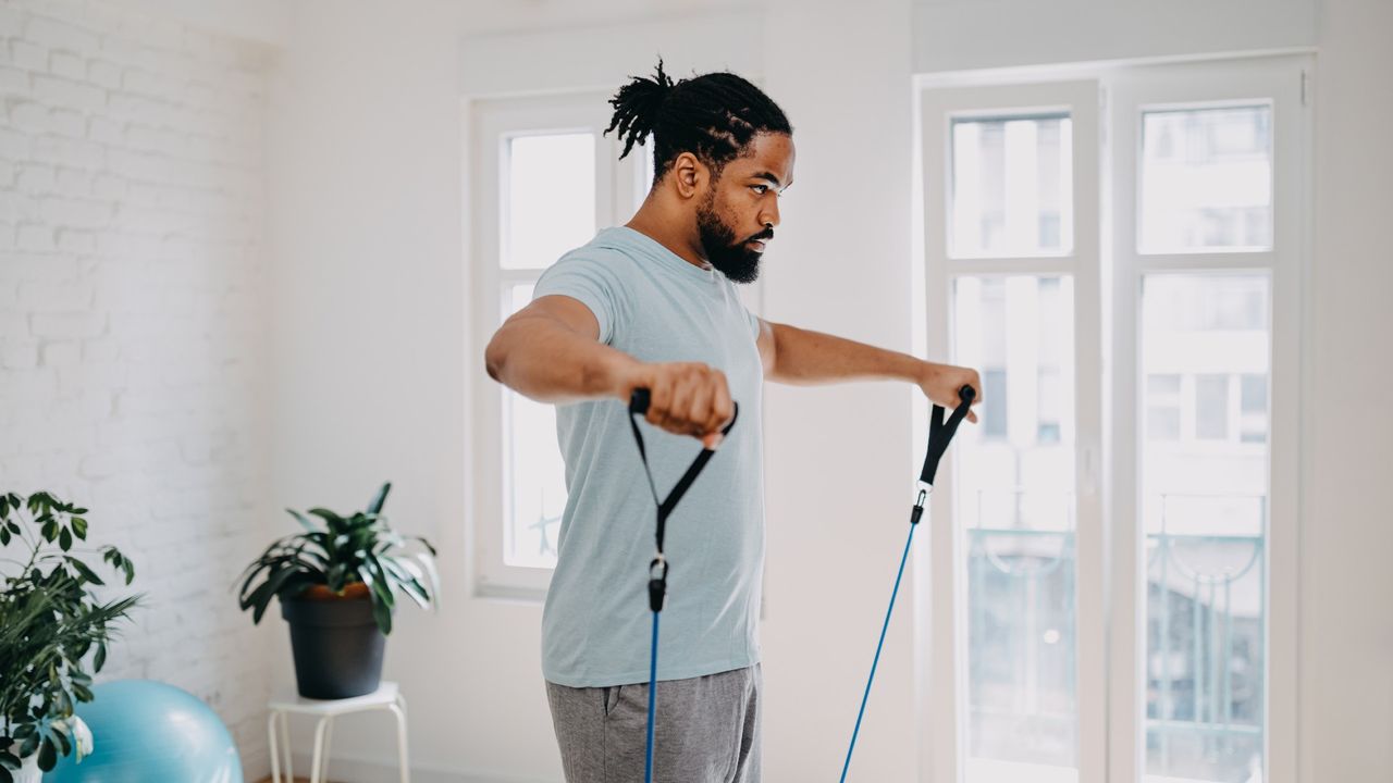 Man doing resistance bands workout