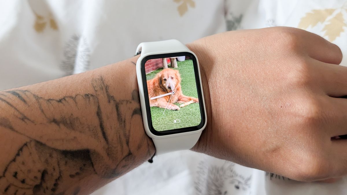 A person wearing a Xiaomi Smart Band 10 Pro smartwatch
