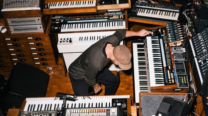 Musician and Wallpaper* Design Awards 2023 judge Nils Frahm surrounded by keyboards