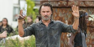 Rick with his hands up in The Walking Dead