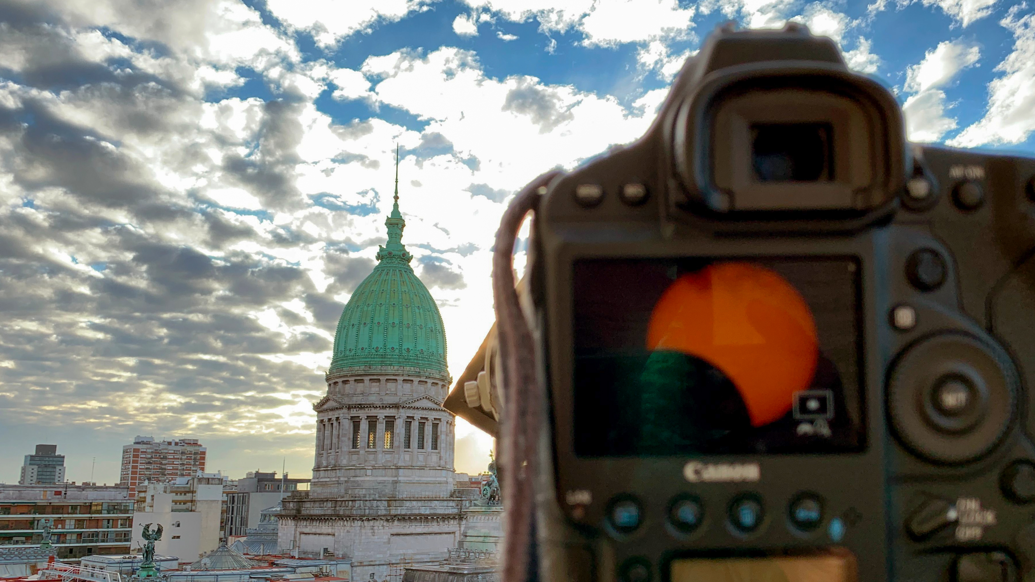 View of the Congress during the solar eclipse, in Congreso neighborhood in the city of Buenos Aires, Argentina, on July 2, 2019. - Tens of thousands of tourists braced Tuesday for a rare total solar eclipse that was expected to turn day into night along a large swath of Latin America's southern cone.