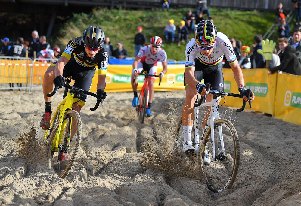 The lead trio rides through the sand