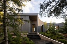 Cut Out House, a square footprint home with a round cut out set in the canadian winderness, by a lake