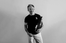 Charles Curtis with bottle of wine