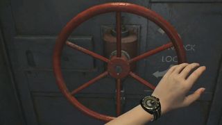 Grace's hand reaches for a vault wheel on the Resident Evil Requiem Cold Storage door.