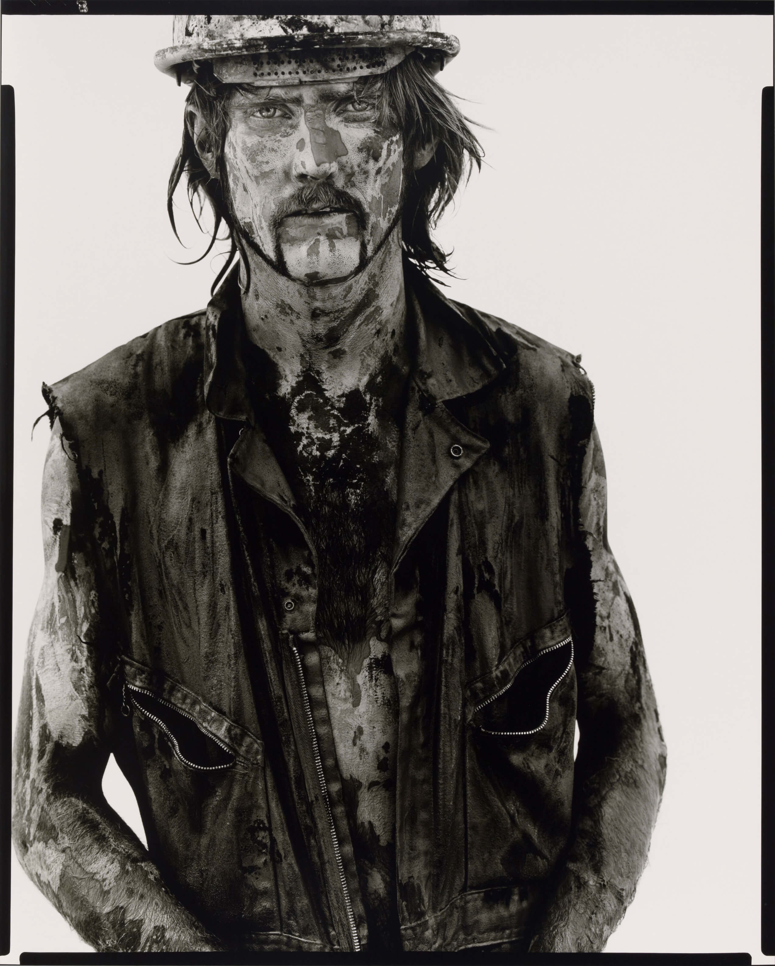 Man covered in oil. 