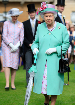 Queen Elizabeth II attends a garden party at Buckingham Palace in London on May 19, 2016