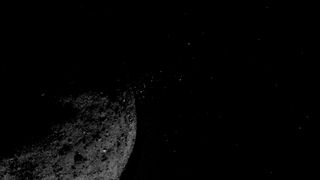 an asteroid shooting debris into space