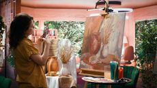 Woman takes photo of her rustic work of art