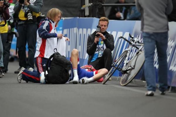 Great Britain's David Millar collapsed on ground after the time trial