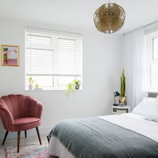 master bedroom with white wall and white bedlinen