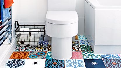 white bathroom with patterned floor tiles