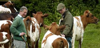 Prince William talks to his father, the Prince of Wales on his father's Duchy Home Farm in Tetbury, Gloucestershire.