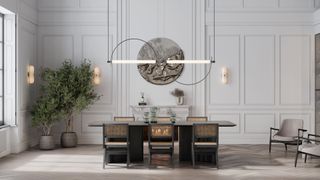 Shot of a dining room with an asymmetrical light fixture over a dining room table