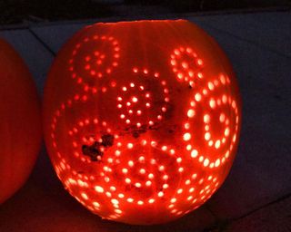 A pumpkin carving idea with drilled holes