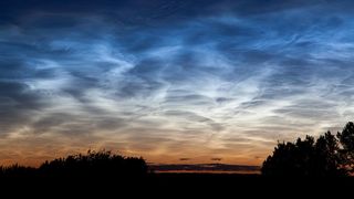 Noctilucent clouds appeared in the sky above Edmonton, Alberta, in Canada on July 2, 2011.