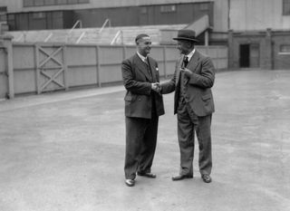 Peter McWilliam shakes hands with Tottenham secretary and former player Billy Minter ahead of taking up his role as manager of Spurs in 1938.