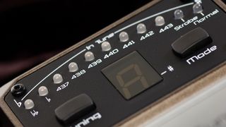 Closeup of the LED lights on a guitar tuner pedal