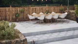 raised patio with white patio furniture