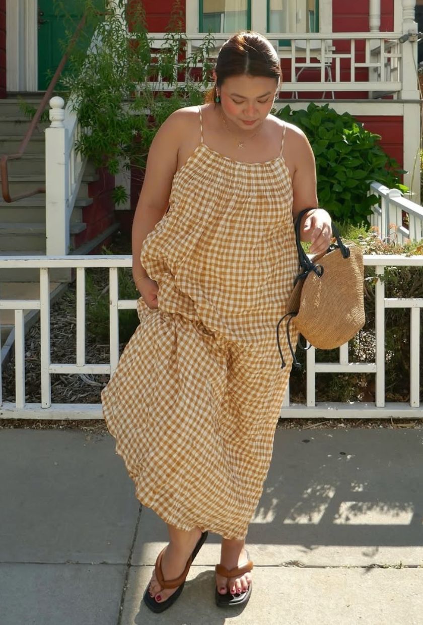 @marina_torres wears a yellow gingham midi dress