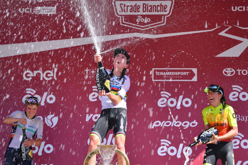 SIENA ITALY AUGUST 01 Podium Leah Thomas of The United Statesand Team Equipe Paule Ka Annemiek Van Vleuten of The Netherlands and Team Mitchelton Scott World Champion Jersey Margarita Victoria Garcia Caellas of Spain and Team Ale BTC Ljubljana Celebration Champagne Trophy during the Eroica 6th Strade Bianche 2020 Women Elite a 136km race from Siena to Siena Piazza del Campo StradeBianche on August 01 2020 in Siena Italy Photo by Luc ClaessenGetty Images