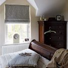 bedroom storage with cushion and chest of drawers